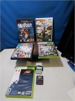 Group of game discs including Xbox 360