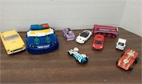 Assorted toy cars, transformer,train
