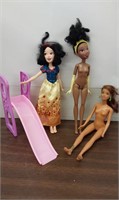 Assorted dolls- snow white, other barbies. Slide