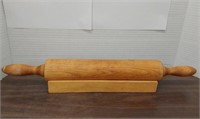 Vintage rolling pin with holder.  Made by