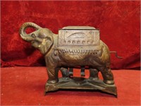 Old cast iron elephant cigarette dispenser.