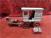 Cast iron horse drawn milk wagon w/driver.
