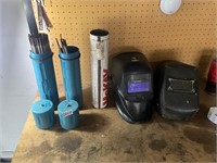 70/18 welding rods, one auto helmet, one regular