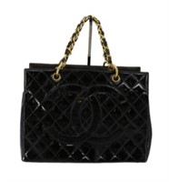CHANEL Black Handbag with Gold Chain Accents
