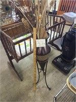 Decorative metal vase and stand.