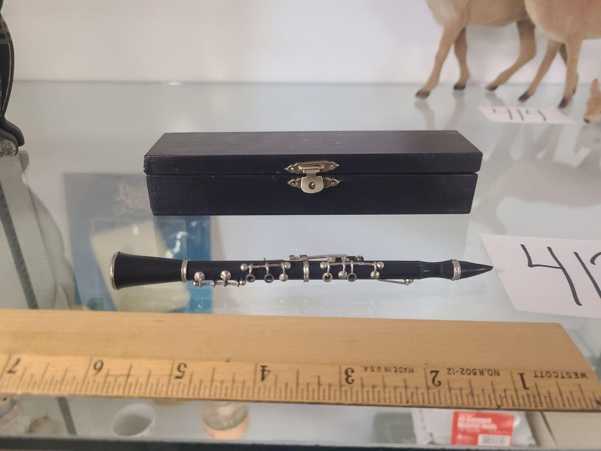 Mini flute in case.
