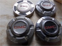 (4) GMC hubcaps