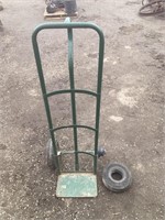 Green cart with broken wheel