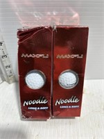 2 boxes of golf balls