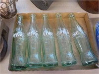 5 Coca Cola Bottles