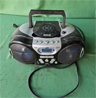 RCA boom box radio with CD player, old Polaroid