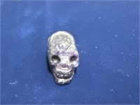Crystal skull about 1 inch size purple
