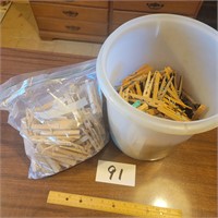 Tupperware Container full of Clothes Pins