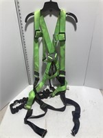 Safety harness with shock absorbing strap