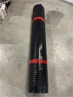 Roll of black plastic under flooring
