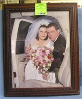 Modern wedding photo in mahogany frame