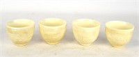 Four Carved White Glazed Porcelain Cups