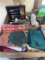 Box of kitchen towels, potholders, kitchen