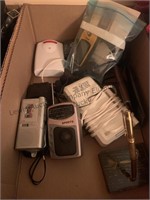 Two boxes. Old rotary phone, Polaroid, laminator.