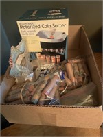 Coin sorter and coin rolls