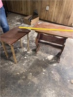2 vintage wooden tables one has bookshelf at the