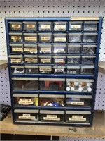 Plastic drawer organizer filled with a variety of