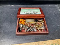 Small box with cuff links and other