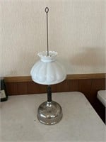 Vintage quick light oil lamp with white shade.