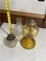 2 older glass kerosene lamps. One shade.