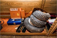 Contents of Shelf - Tractor Yard Tires, Car Jack,
