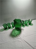 Green depression glass Pitcher and 6 glasses.