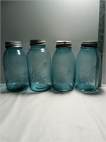 4 large ball perfect Mason jars with lids.