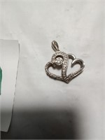 Sterling silver and diamonds.  Double heart