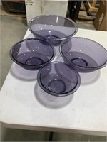 Four Pyrex mixing bowls purple