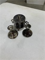Appears to be silver candleholders trinket box