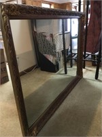 Gold framed wall mirror, 42 inches wide by 30