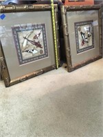 Oriental style framed Cuoi fish pictures.