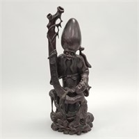 Carved wood Oriental figure with child and bird