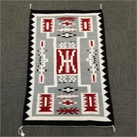 Handwoven Navajo rug with design 31" x 47"