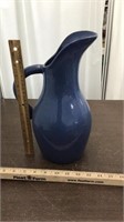 Tall pottery pitcher , blue