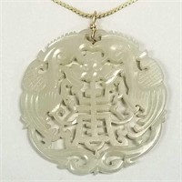 2 1/4" carved jade pendant on 15" long; 14K gold