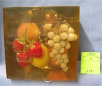 Large fruit decorated Lucite paperweight