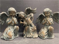 Two of angelic resin garden figures. Approx. 11”
