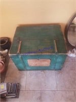 Big green wood box with sign on front