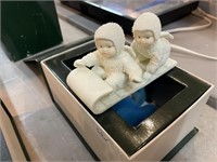 Snow babies sledding figurine