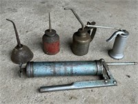4 assorted Oil Cans and a Grease Gun