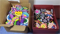 Finished Perler bead projects in two boxes.