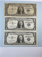 Three 1957 $1 silver certificates