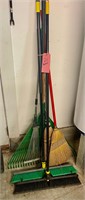 Assorted Brooms and Rakes
