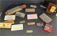Assorted vintage wetstones and honing oil